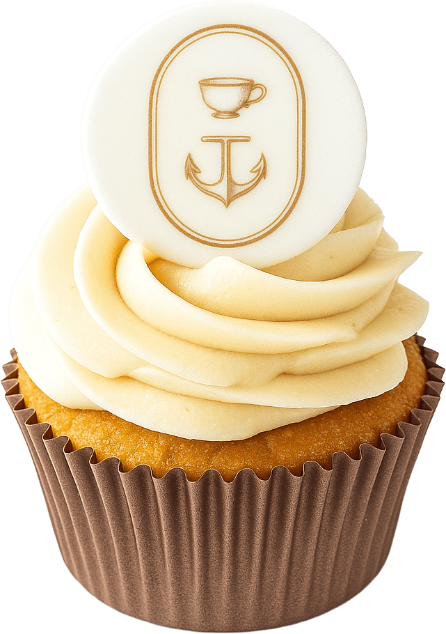 Cupcake with cream frosting and fondant topper featuring cup and anchor design.